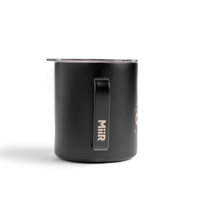 Black Metal Coffee mug with the julbo logo and coordinates of the Julbo HQ in France #color_julbo-camper-mug-12oz-black-mont-blanc