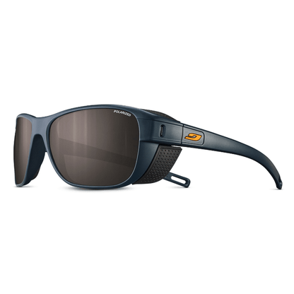 The Julbo-usa Camino sunglasses are dark blue, polarized, with side shields and an orange arm logo—ideal for trekking and shown on a white background. #color_matte-dark-blue-black-with-spectron-3-polarized-lens