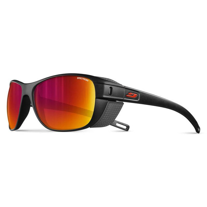 Julbo-usa Camino black sports eyewear, featuring red-orange reflective lenses and side shields ideal for trekking, is displayed against a white background. #color_black-with-spectron-3-lens