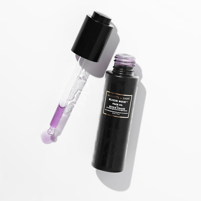 Image of an open Nannette de Gaspé Elixir Noir Face Oil
