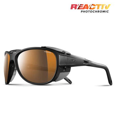 The Julbo-usa Explorer 2.0 sunglasses feature orange-tinted, high-protection lenses with side shields and “Reactiv Technology” in the top right corner—ideal for alpine mountaineering. #color_black-matte-black-with-reactiv-2-4-polarized-lens