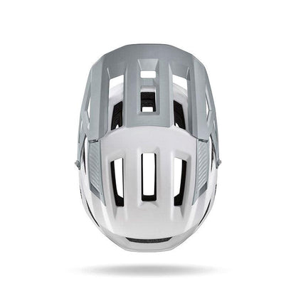 The Julbo USA Forest mountain bike helmet, shown from the front in white and gray, features multiple rectangular vents, a sleek design, and an adjustable fit for added comfort.