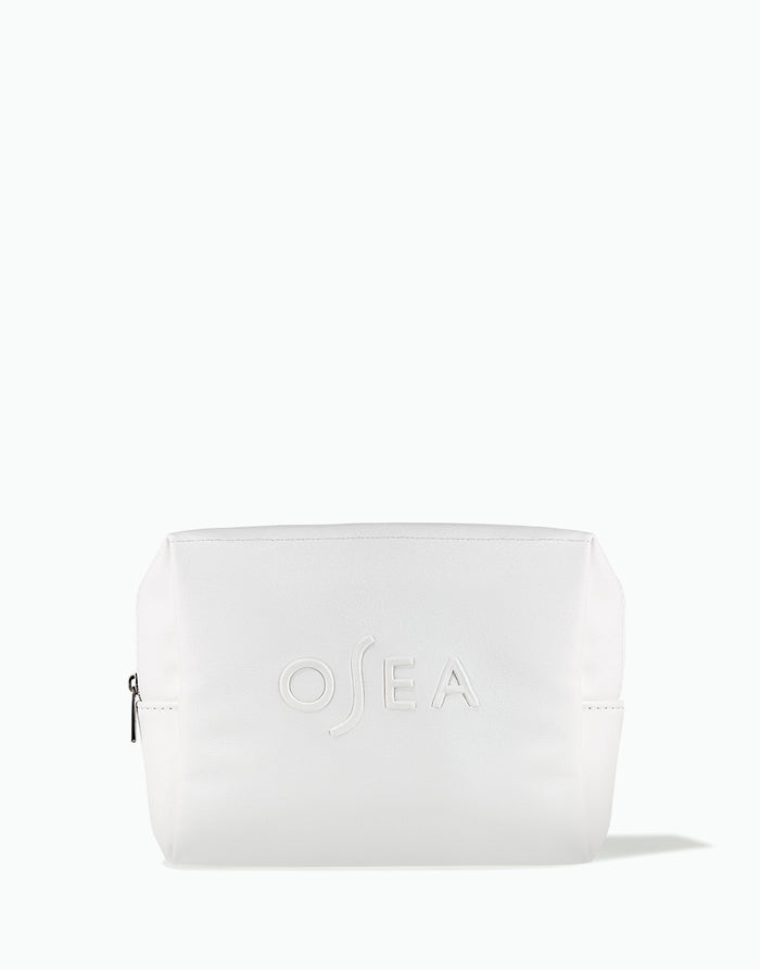 OSEA white zippered cosmetic bag with embossed logo on white background for ecommerce display