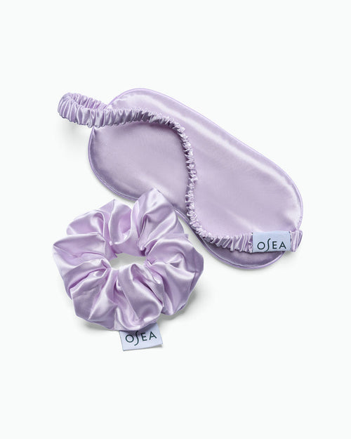 OSEA lavender satin sleep mask and matching scrunchie set on white background for ecommerce display