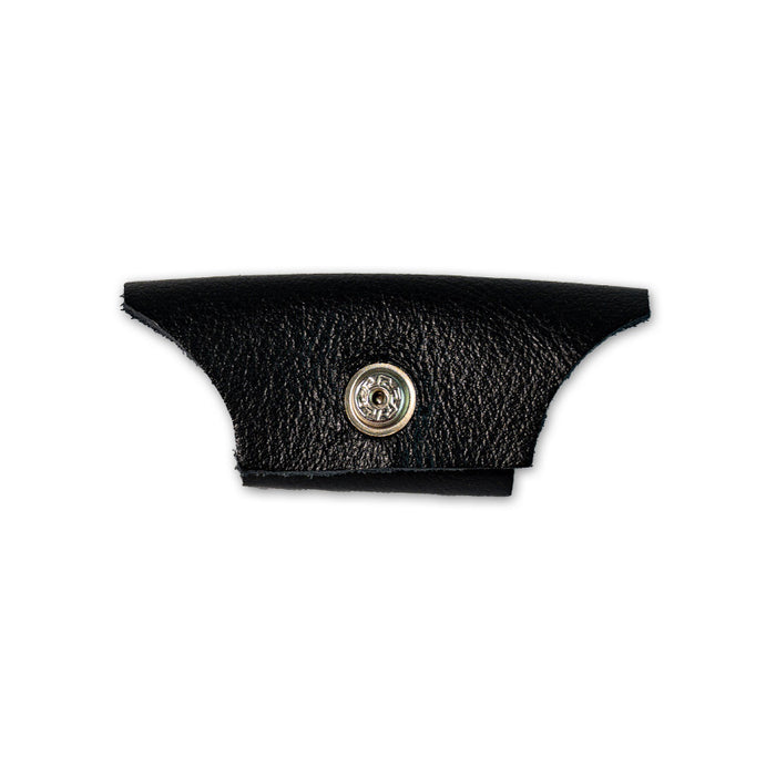 A black leather piece with a metallic snap button for Vermont Lenses & Parts by Julbo USA, ideal as side shields or temple arms, displayed on a white background. #color_vermont-nose-cover-black