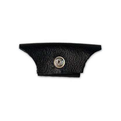 A black leather piece with a metallic snap button for Vermont Lenses & Parts by Julbo USA, ideal as side shields or temple arms, displayed on a white background. #color_vermont-nose-cover-black
