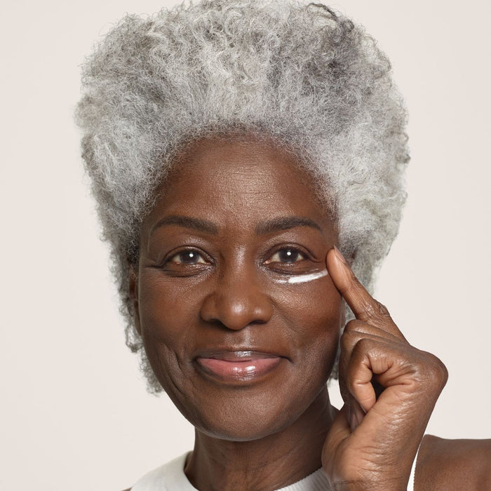 Model image of SunsolveMD ZnO+ Mineral Care Firm + Replenish Eyes SPF 50
